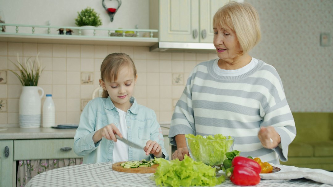 grandmother and granddaughter cooking